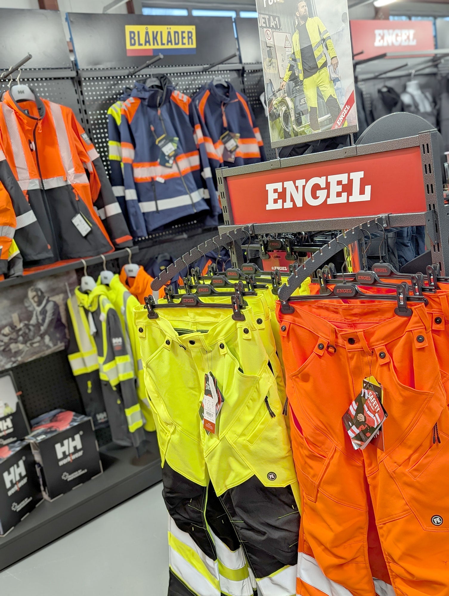 Display of safety gear with 'Engel' branding in a store setting.