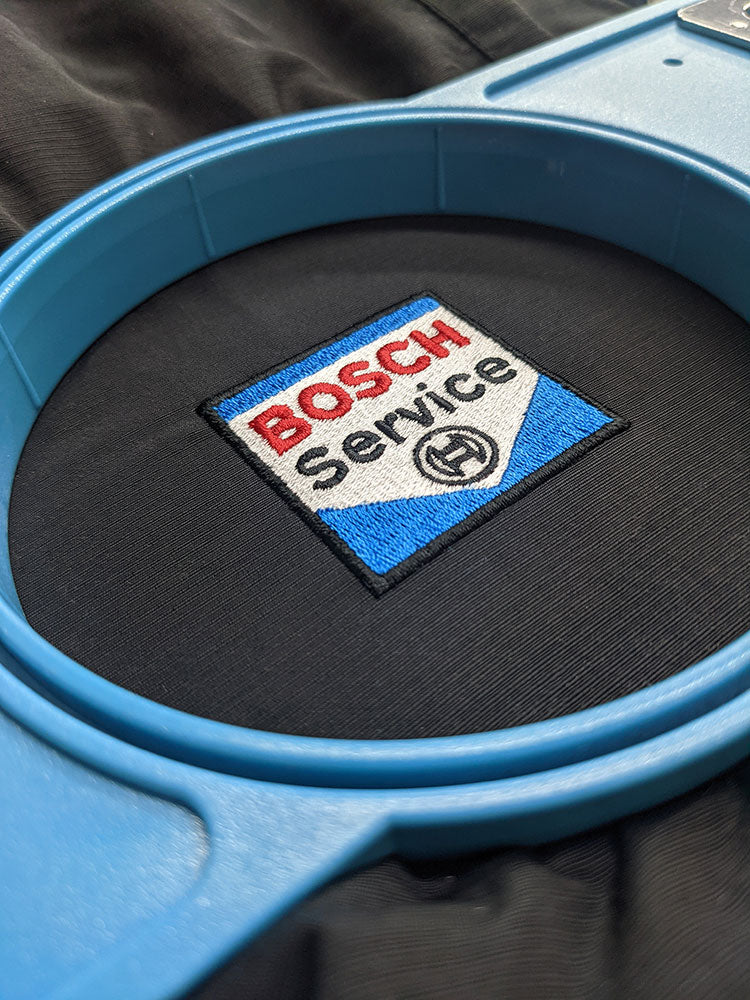 An embroidered Bosch Service logo