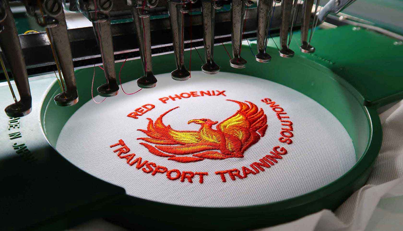An embroidered logo showing detailed stitches and text